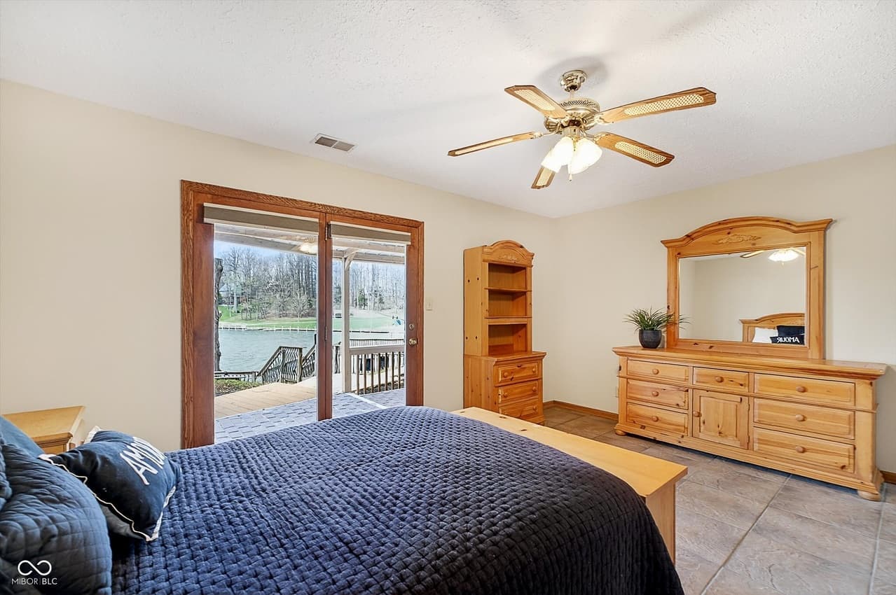 Main bedroom opening to the lake deck