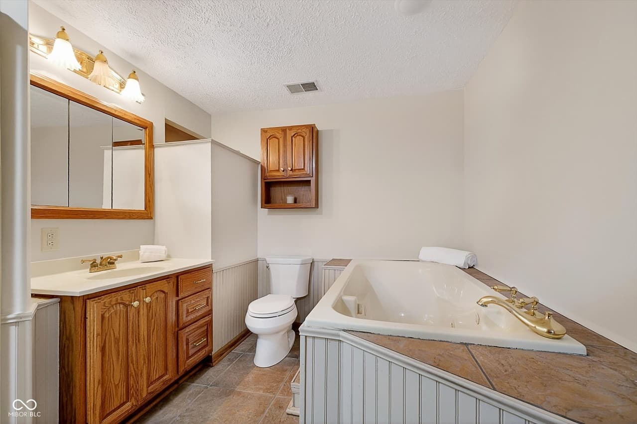 Full bathroom with soaking tub