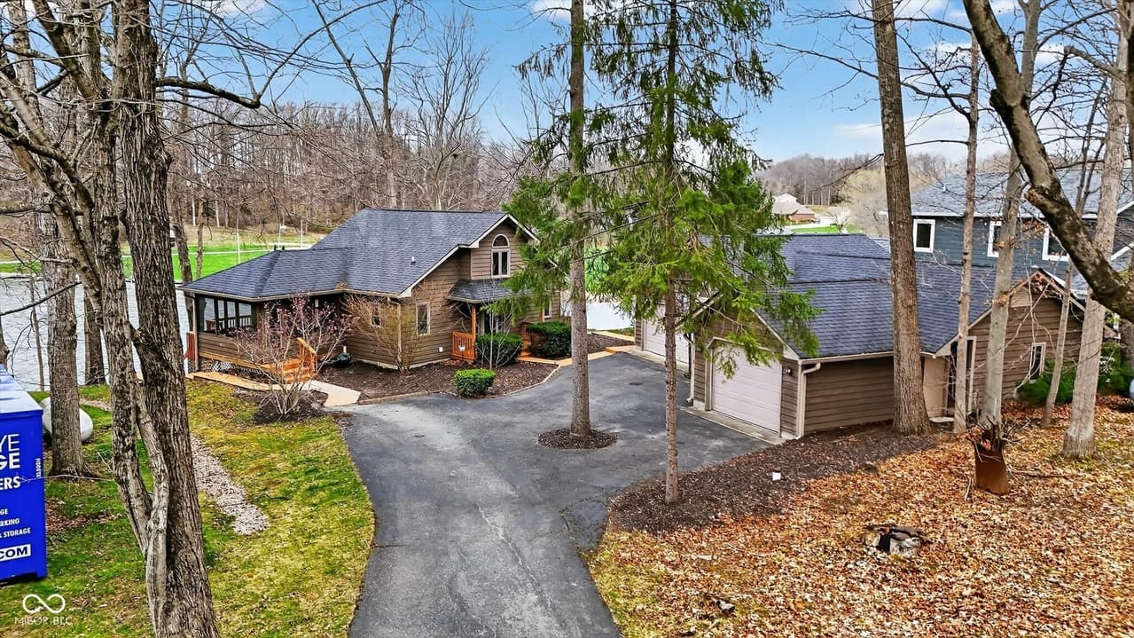 Aerial view of the lake house and property